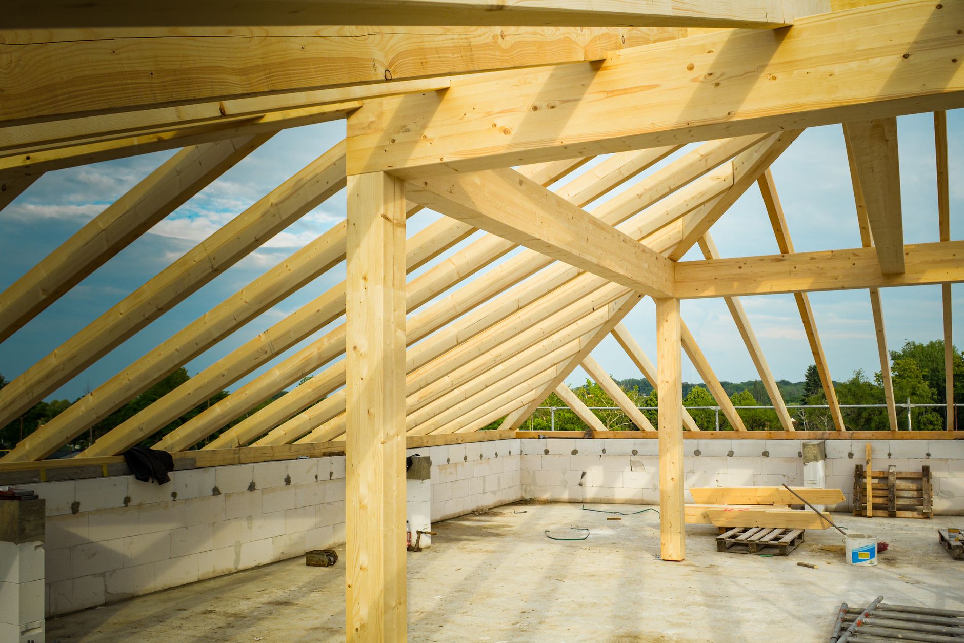 Wooden roof trusses and structural framing on a residential home under construction