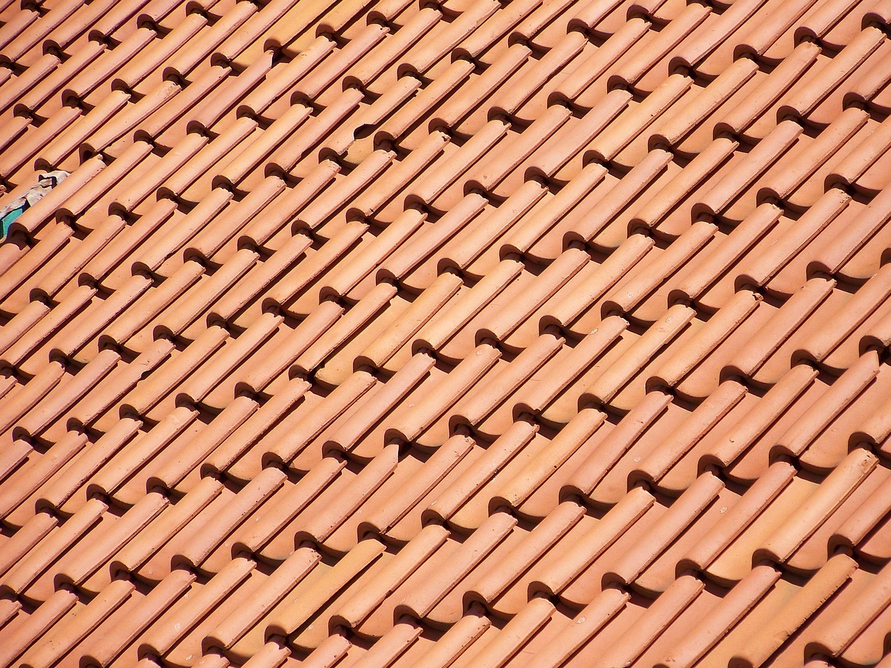 Modern residential roof with new shingles and gutters installed